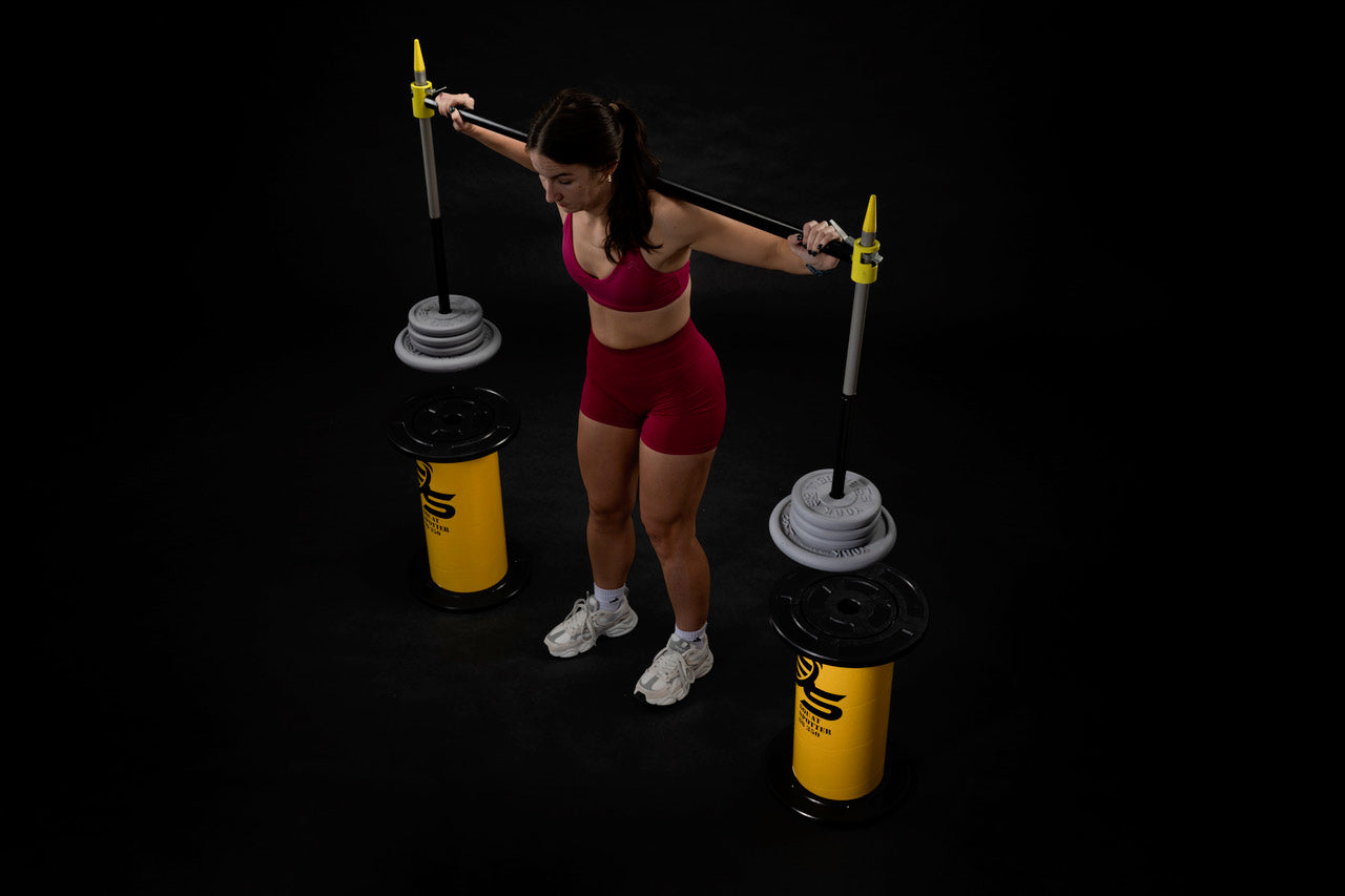 Athlete using squat spotter load position