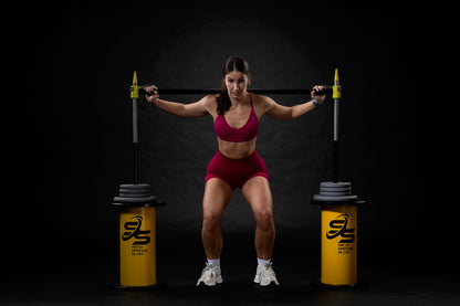 Athlete with squat spotter set up position