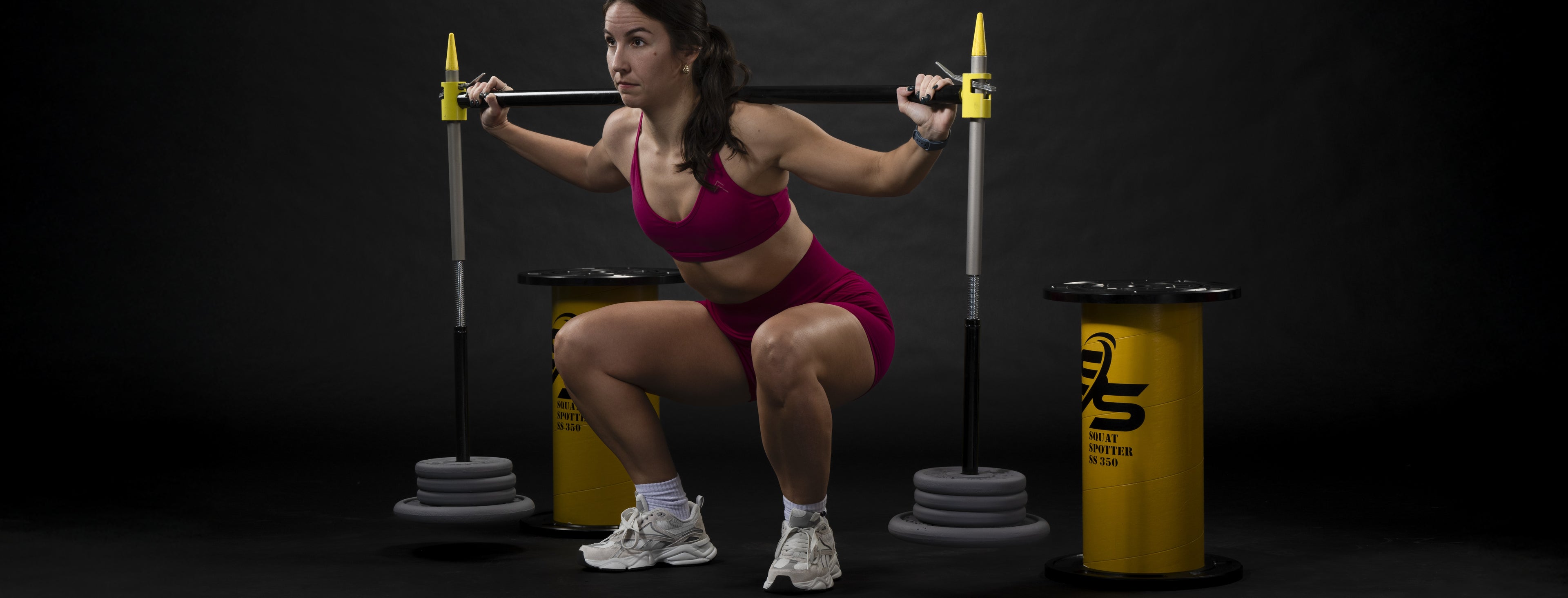 Athlete using squat spotter