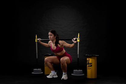 Athlete using squat spotter end position